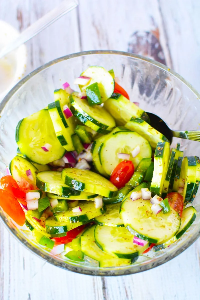 sliced cucumber salad Cucumber Tomato Feta Salad in a bowl