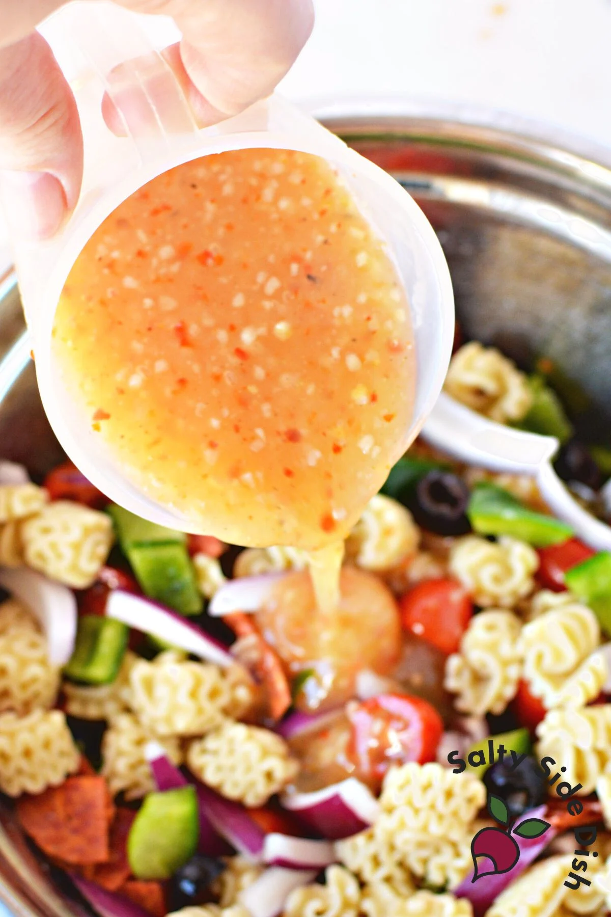 pouring Italian dressing.