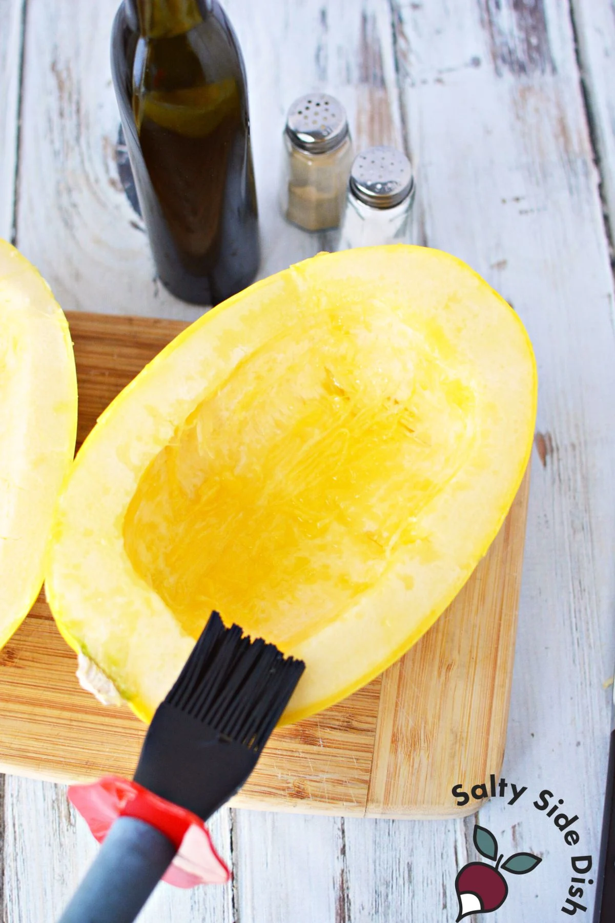 adding oil onto outside of squash.