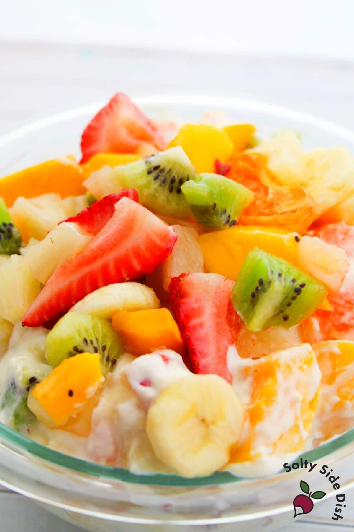 Hawaiian Cheesecake Salad with cut up fruit in a bowl