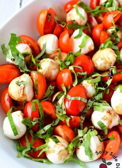 cherry tomato caprese salad in a bowl.