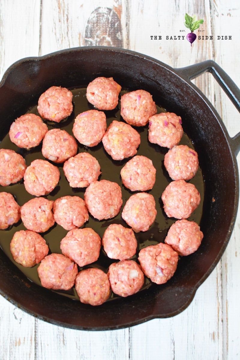 cooking meatballs in cast iron pan