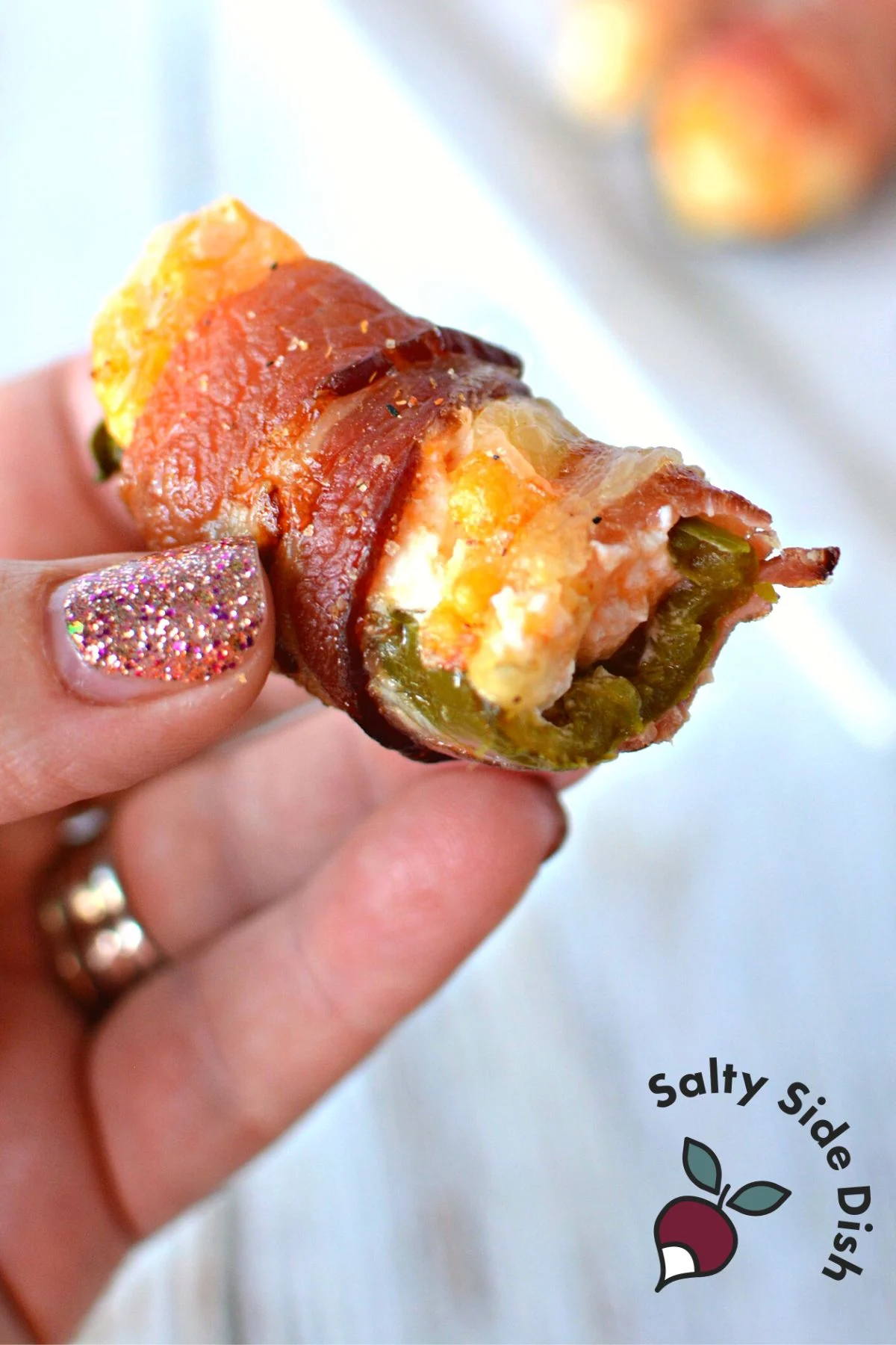 cream cheese stuffed peppers wrapped in bacon.
