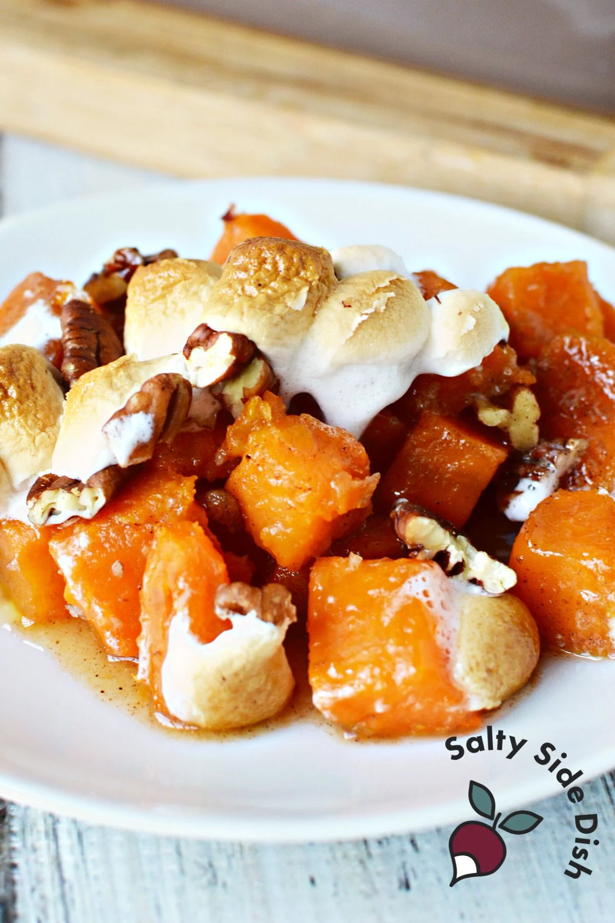 plate of baked sweet potato casserole with melty marshmallows.