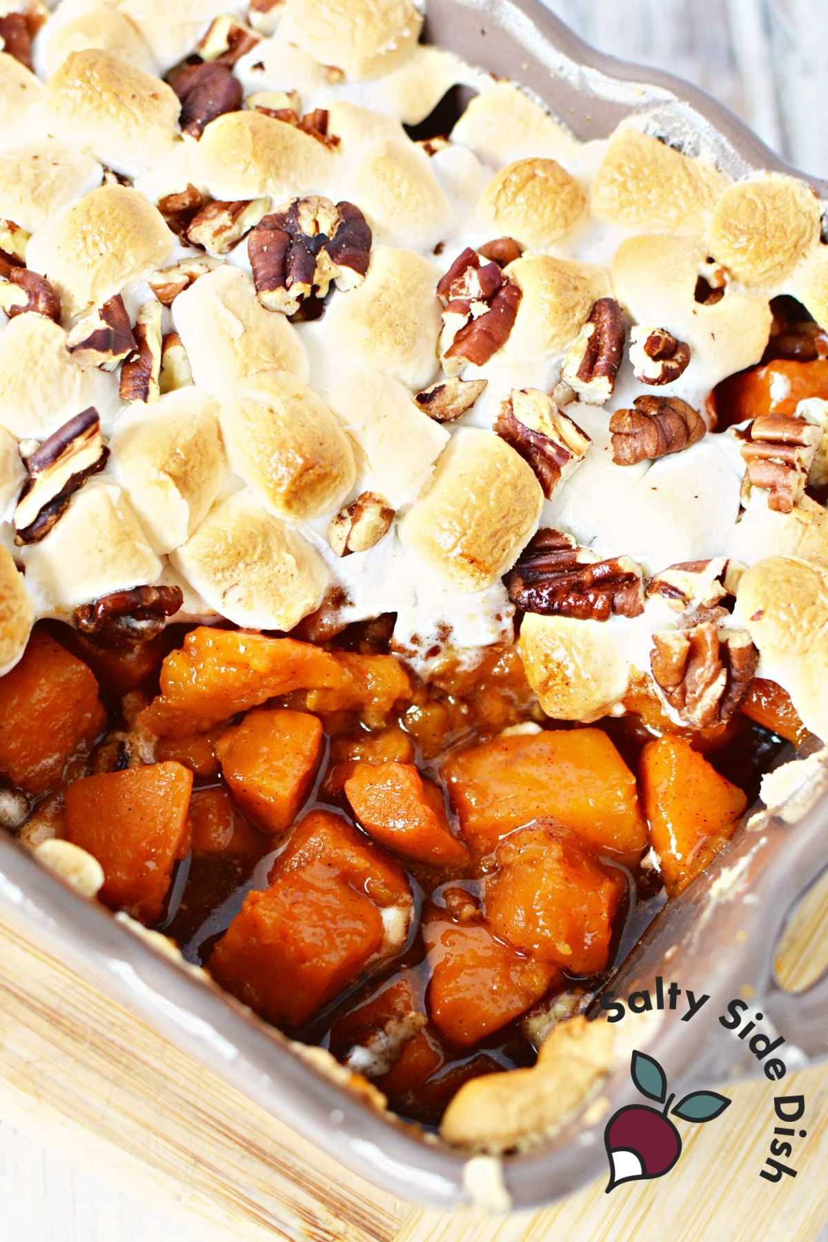 spoonful out of sweet potato casserole showing all the melted brown sugar.