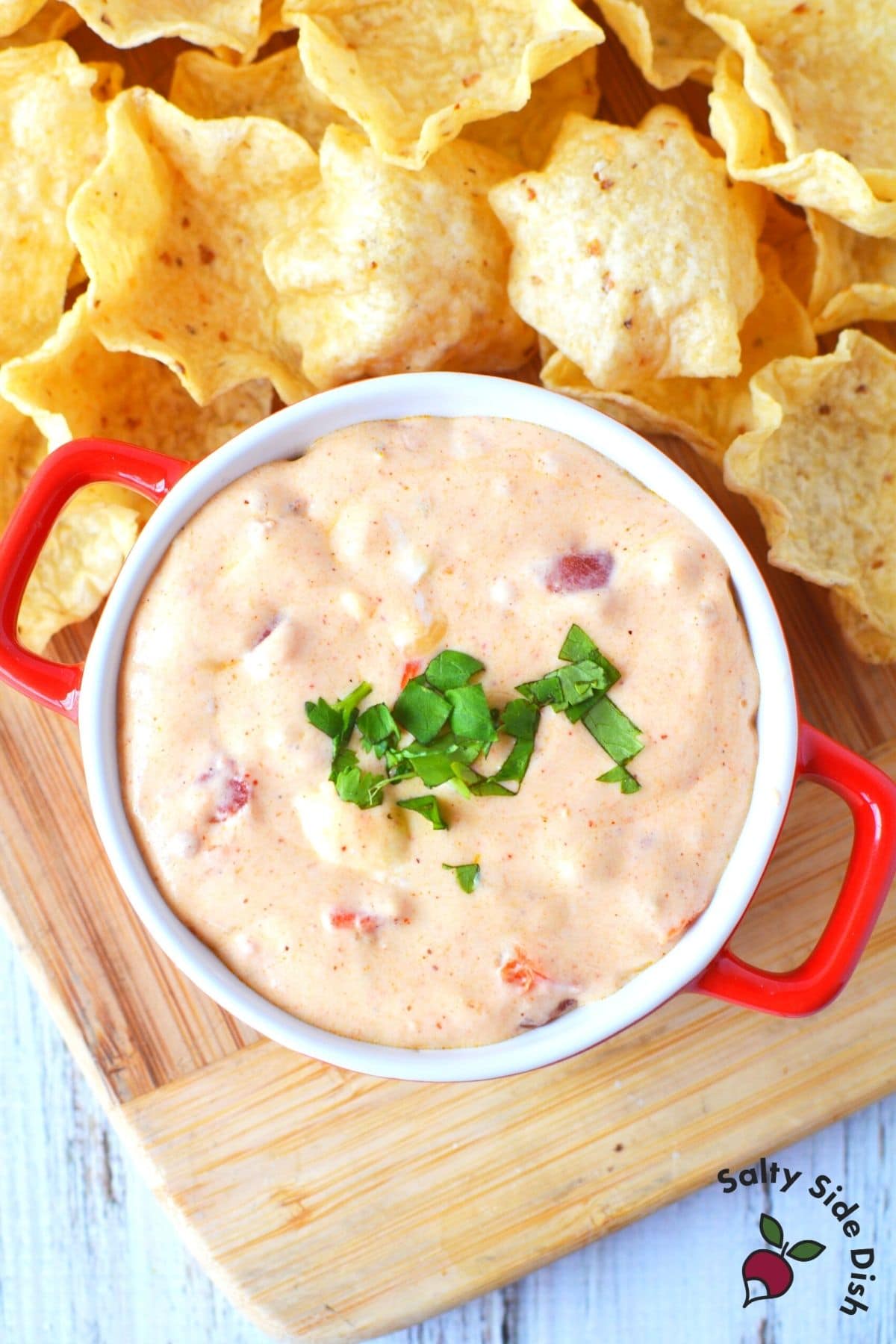 dip in tiny casserole dish surrounded by chips