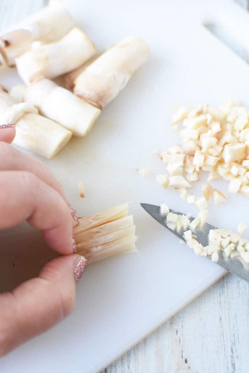 stuffed mushrooms recipe is easy - start by pulling out the stems and cutting down into pieces