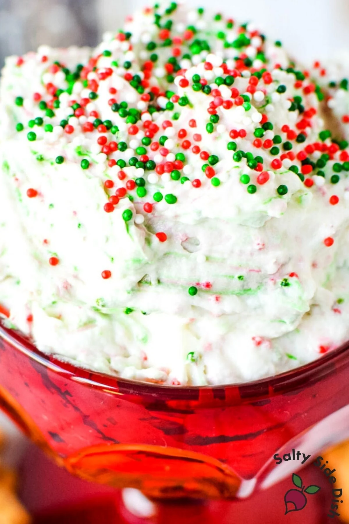 christmas dip in a red bowl with sprinkles.