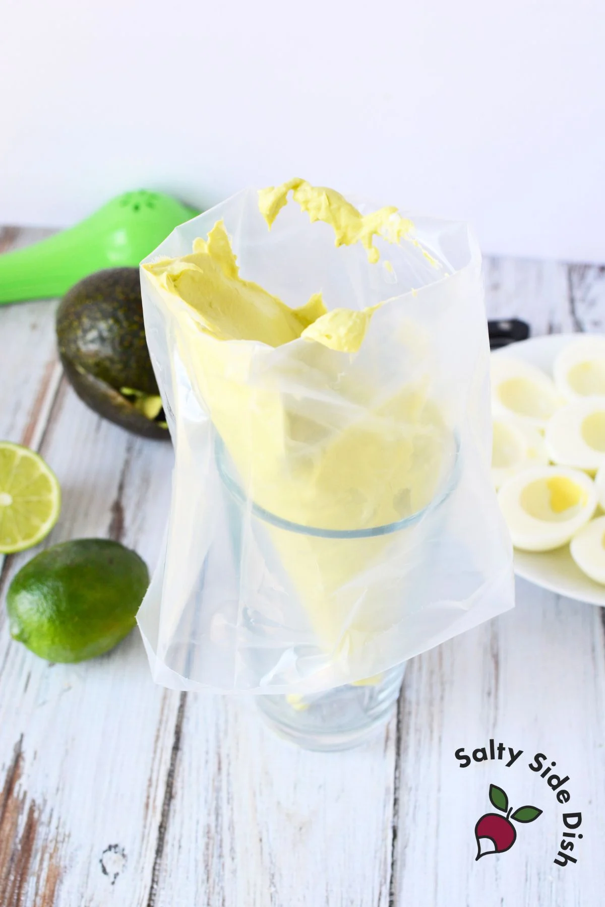 adding deviled egg in a piping bag.