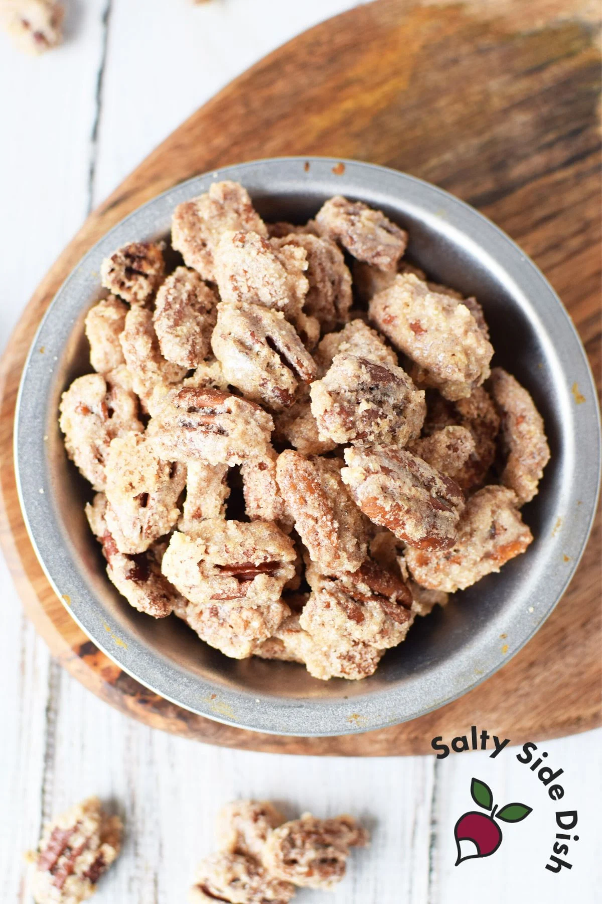 homemade cinnamon sugar pecans in a silver bowl.