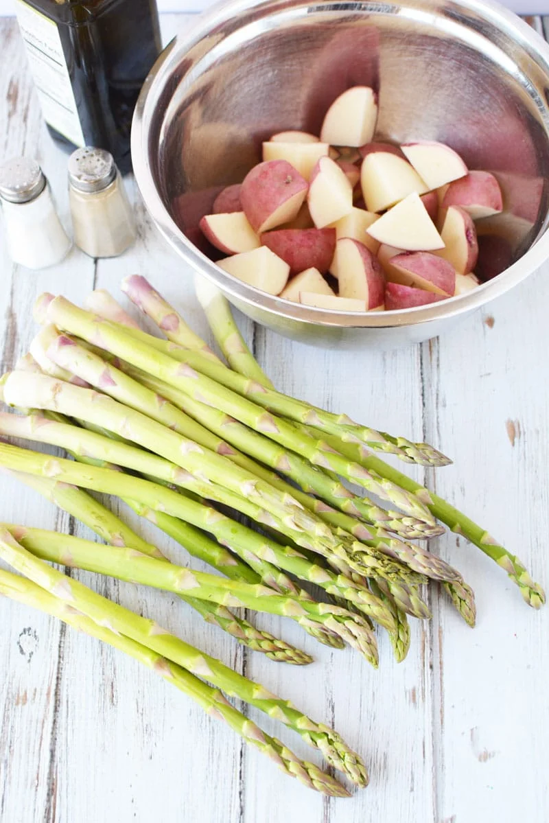 Red Potatoes cut in a bowl and Asparagus ready to be made