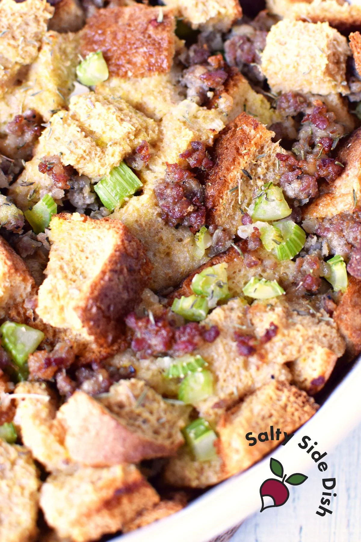 large bowl of old fashioned sausage stuffing with herbs and spices.