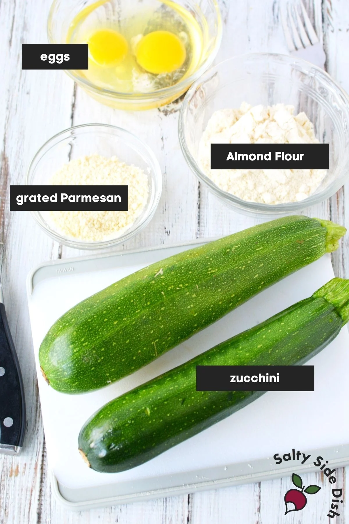 list of keto fried zucchini ingredients laid out on a table.