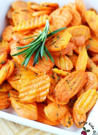 oven roasted carrots with rosemary in a white bowl