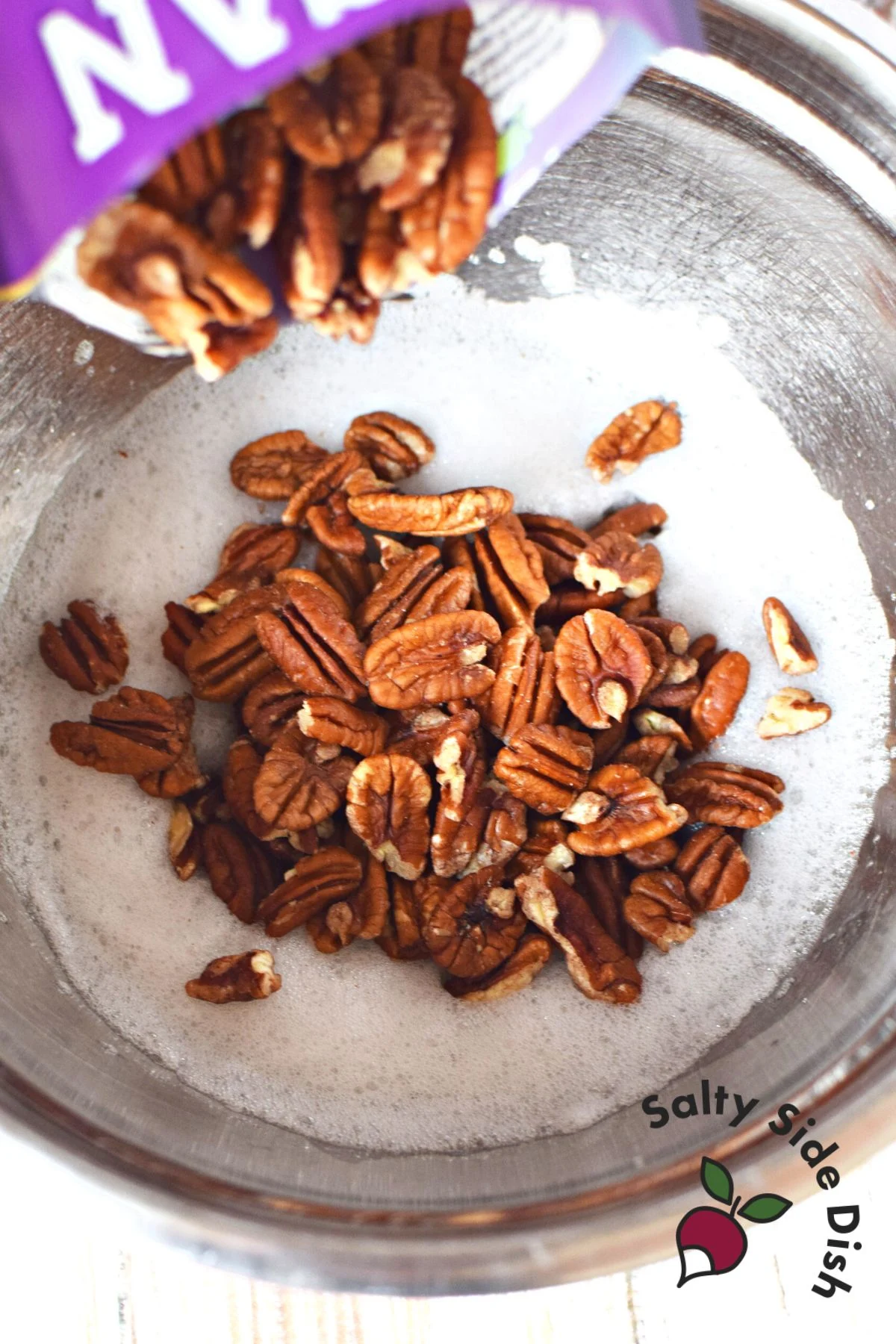 pour pecans into egg foam.
