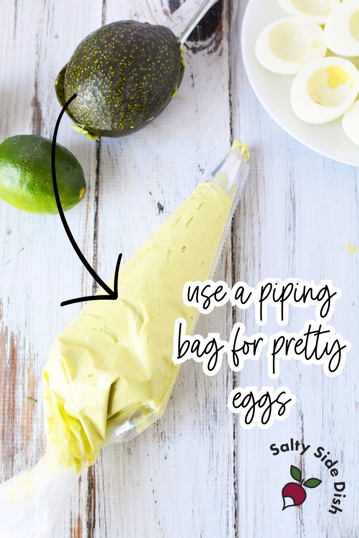 avocado deviled egg yolks in a piping bag.