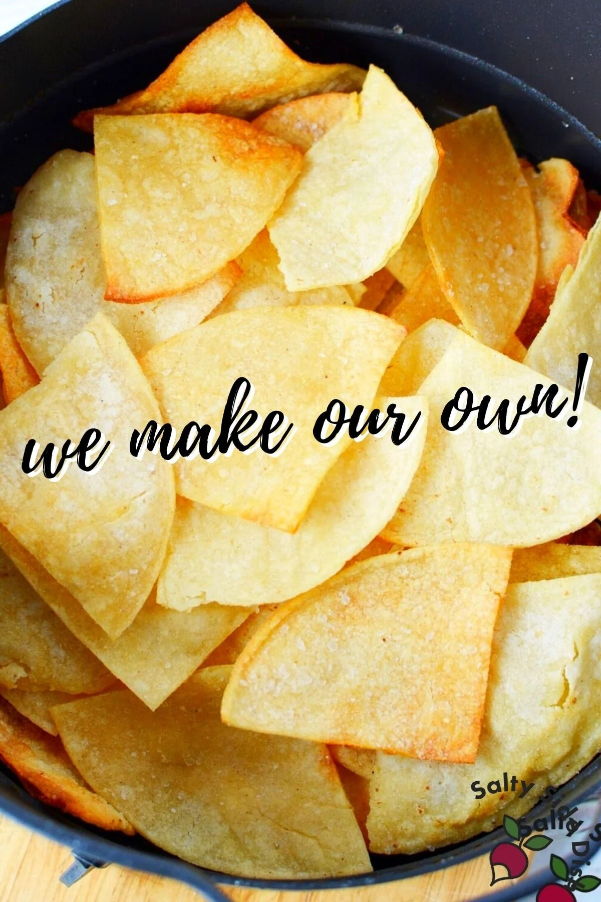 homemade tortilla chips in an air fryer basket.