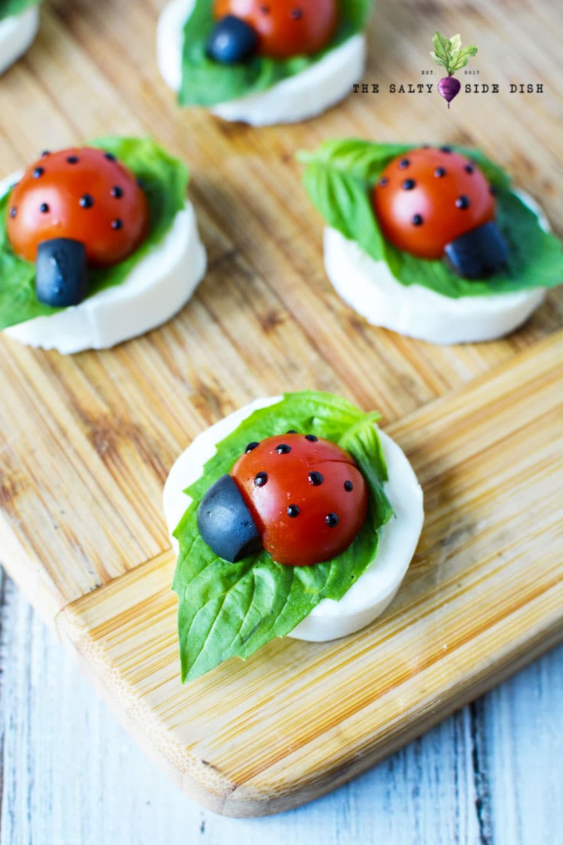 ladybug caprese with tomatoes and mozzarella.
