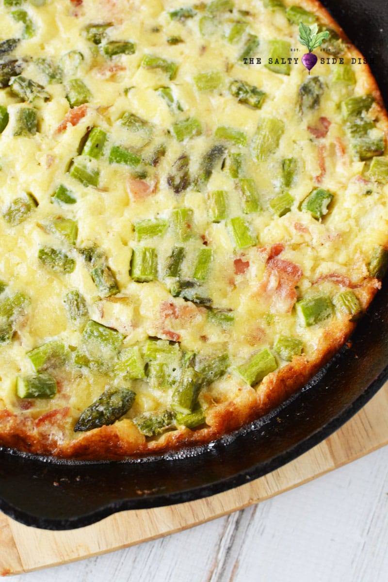 Crustless Parmesan Quiche with bacon and asparagus Baked in a cast iron pan