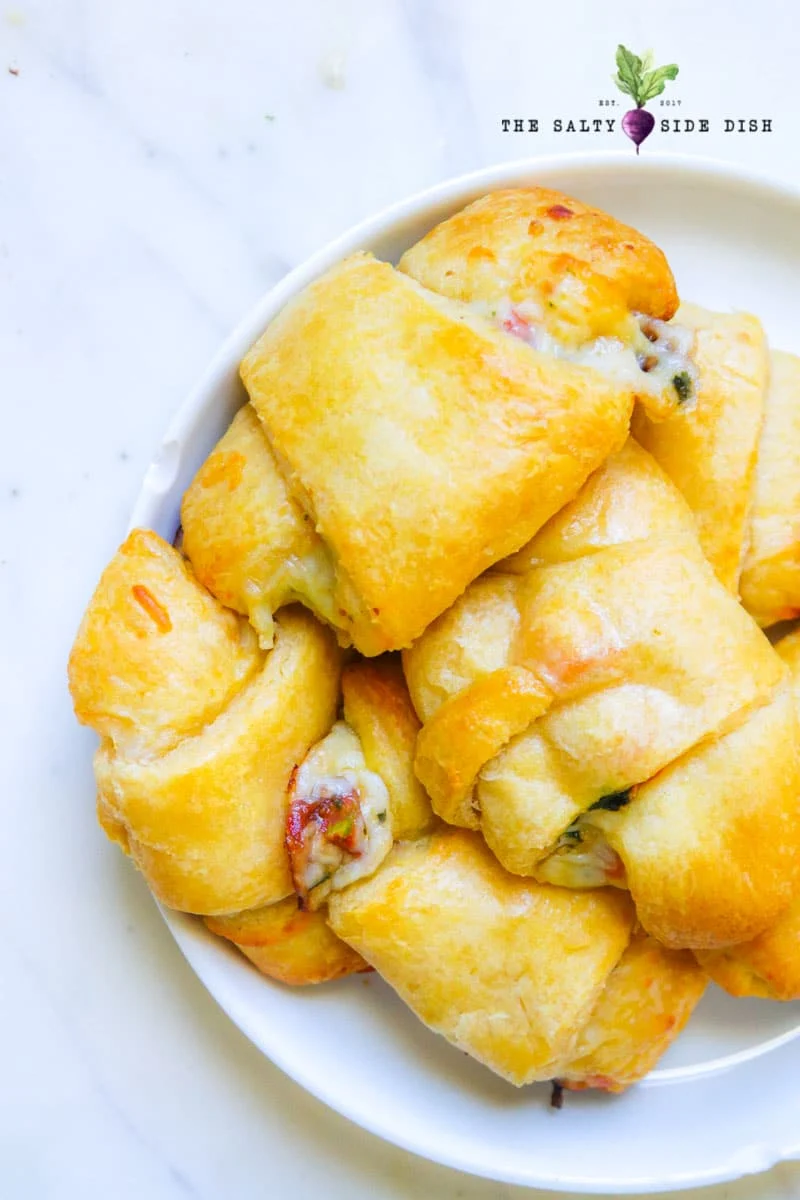 bowl of flaky crusty croissants that will go quickly