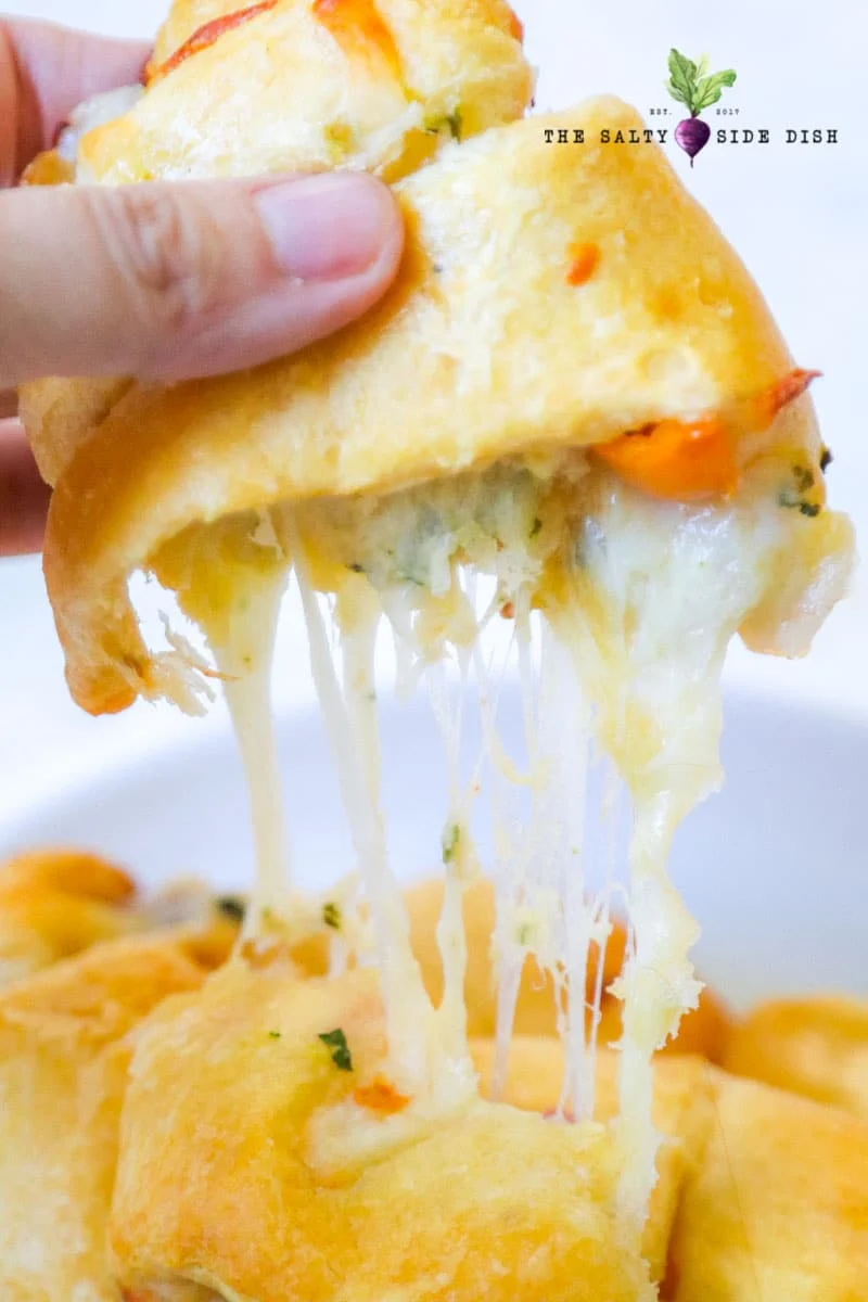 Cheesy croissant with melted cheese and tomatoes