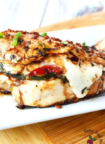 chicken breast with cheese and tomatoes falling out.