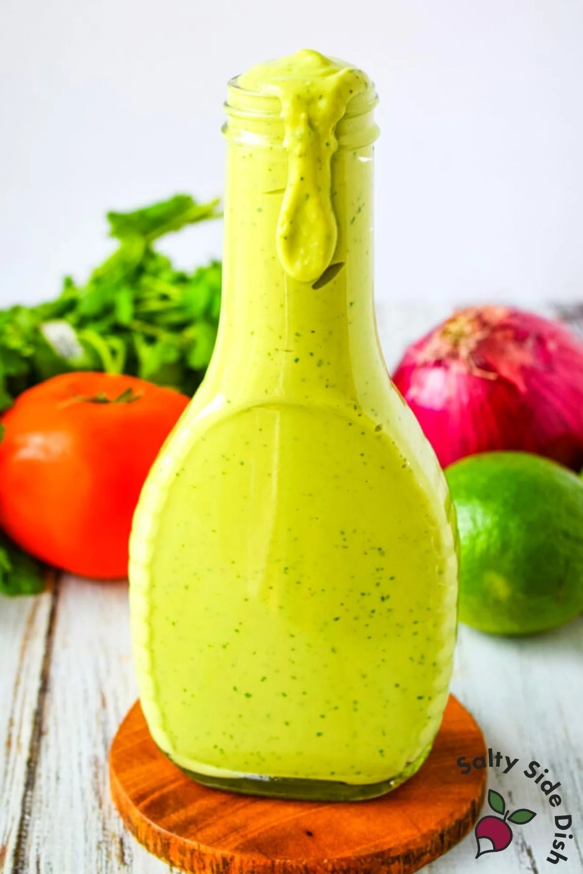 tall bottle of homemade avocado dressing.