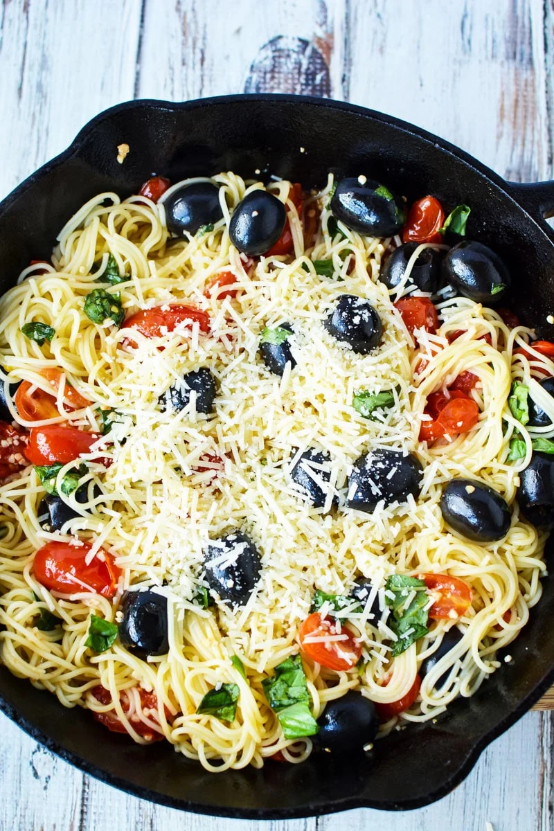 hot side dish in a cast iron pan, caprese dish.