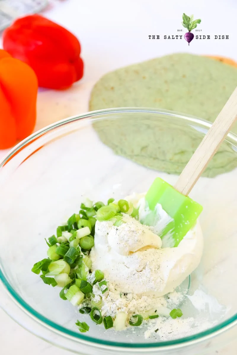 mix your ranch seasoning and cream cheese for a mixture that can be spread on tortillas