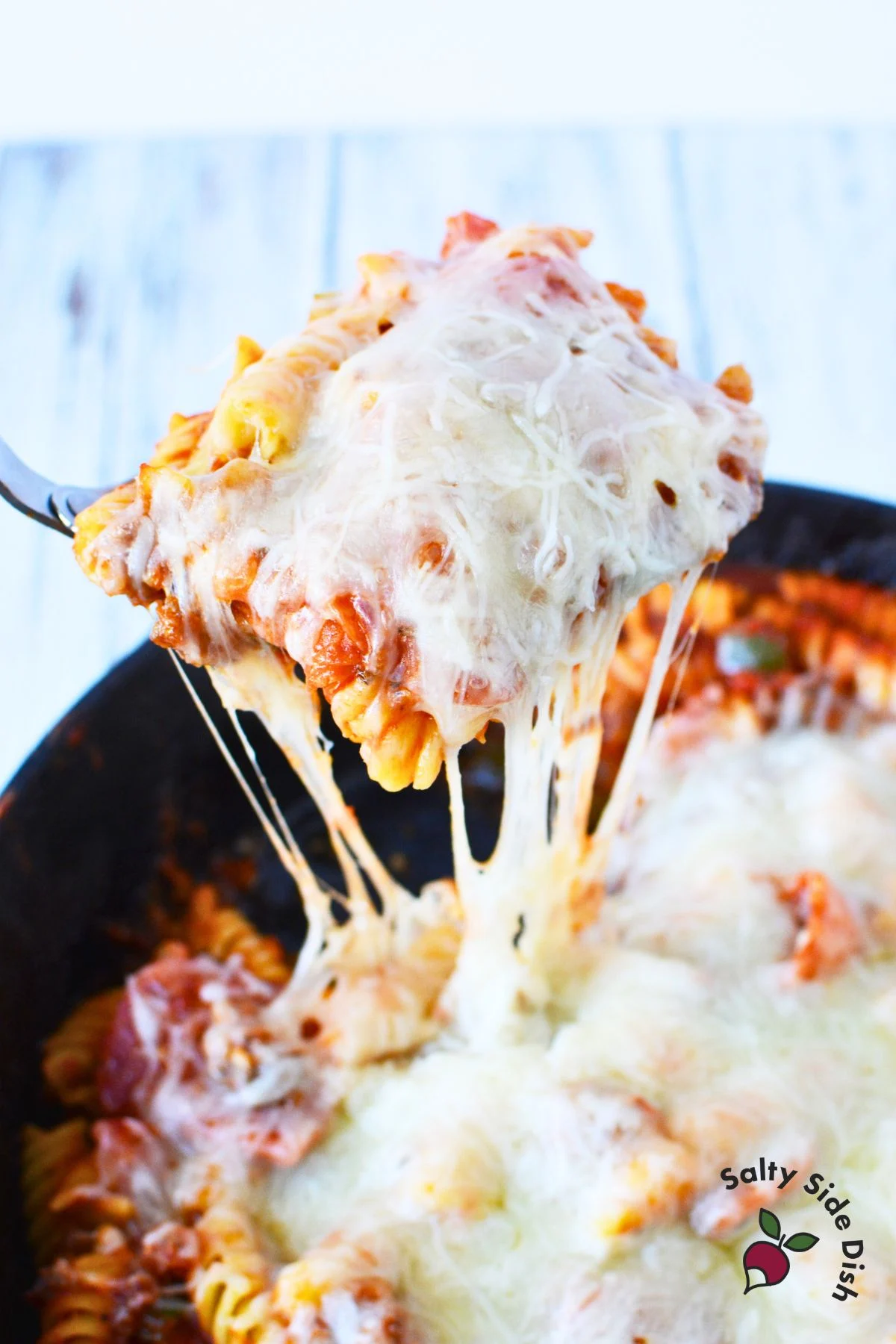 pizza casserole in a cast iron pan.