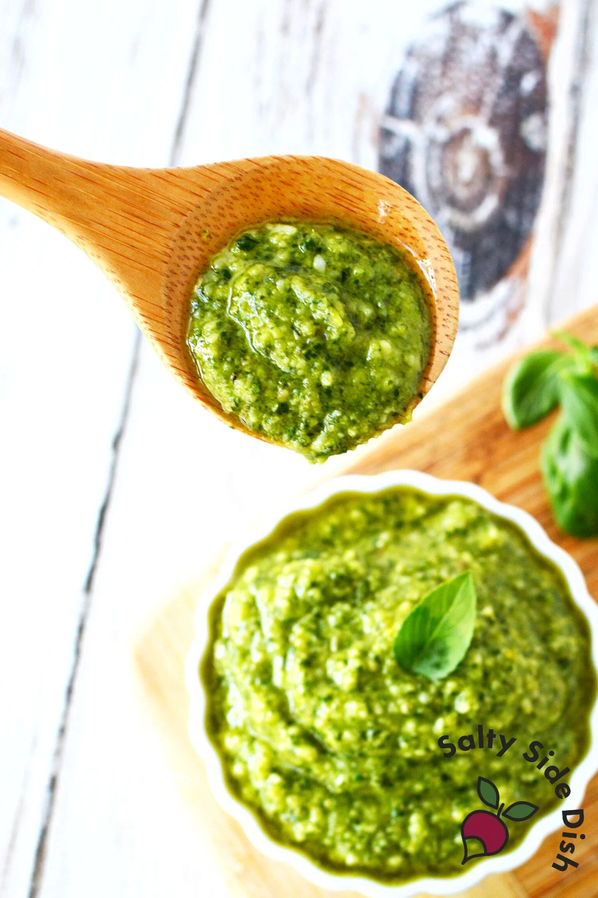 best pesto basil recipe on a wooden spoon.