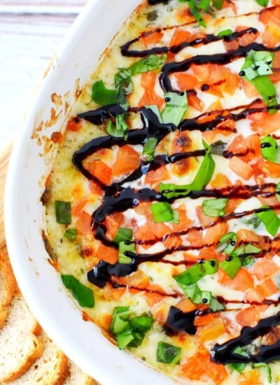 caprese dip with balsamic vinegar reduction on top