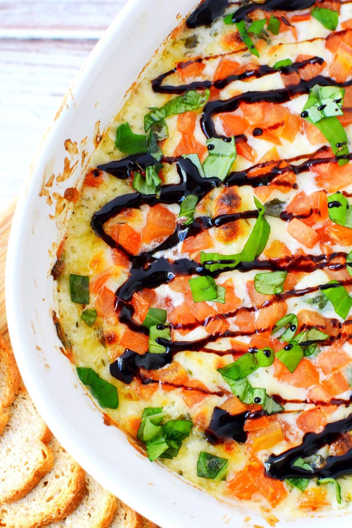 caprese dip with balsamic vinegar reduction on top