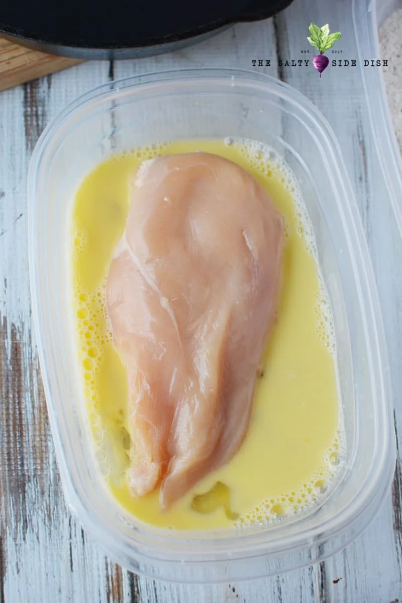 dredge chicken breast in egg wash on both sides