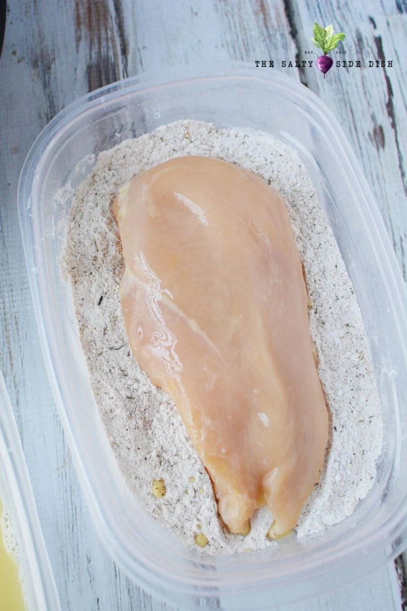coat chicken breasts with seasoned flour