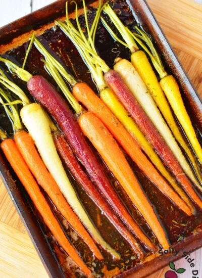 colorful carrots on a baking sheet.