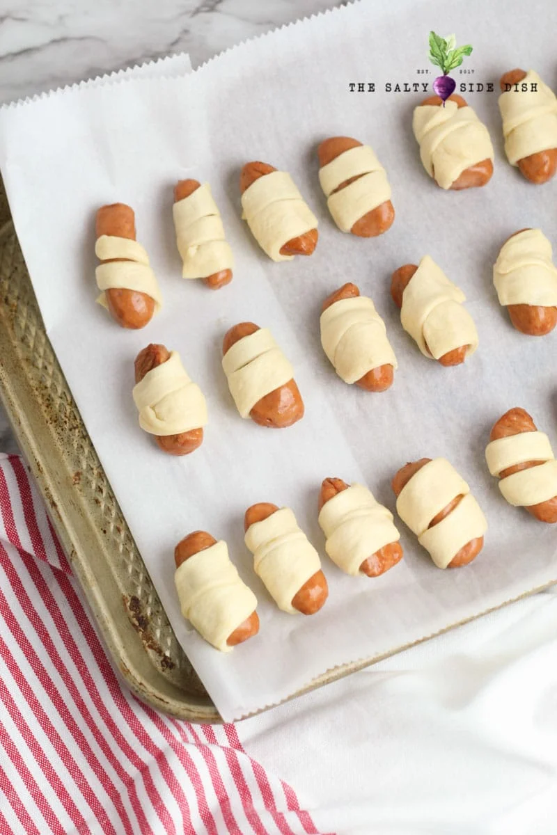 roll hot dogs in crescent rolls