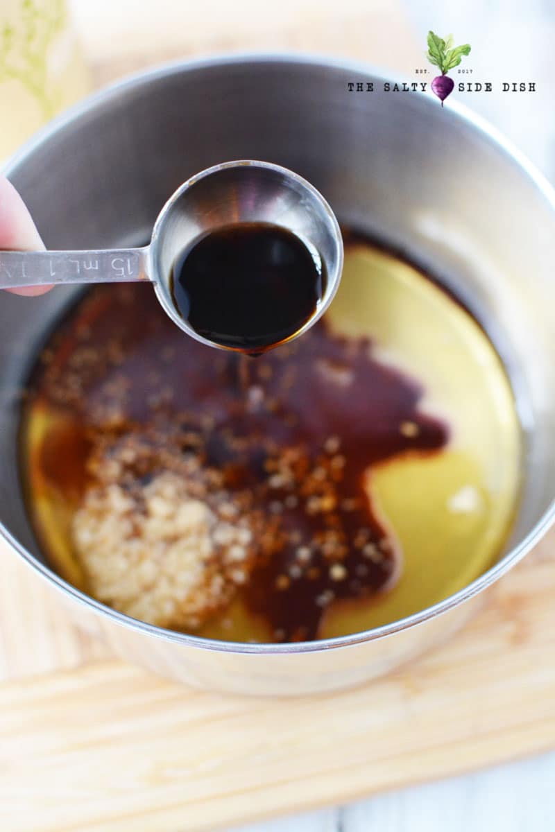 soy sauce ready to dump into chicken honey glaze pot