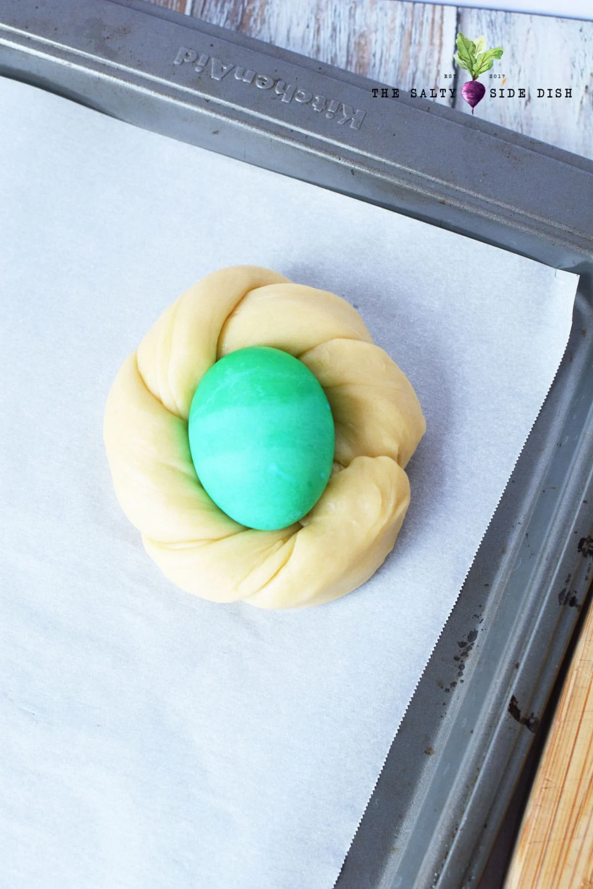 twist dough into nest and add raw egg