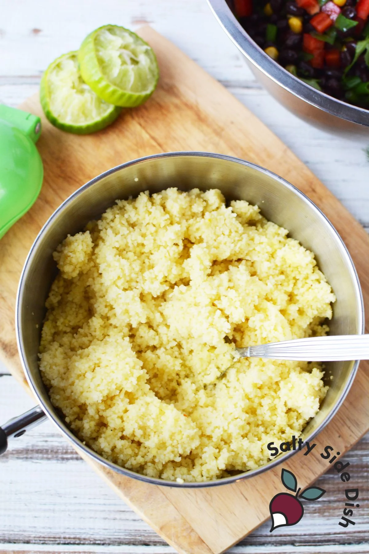 a large saucepan full of fluffy cooked couscous.