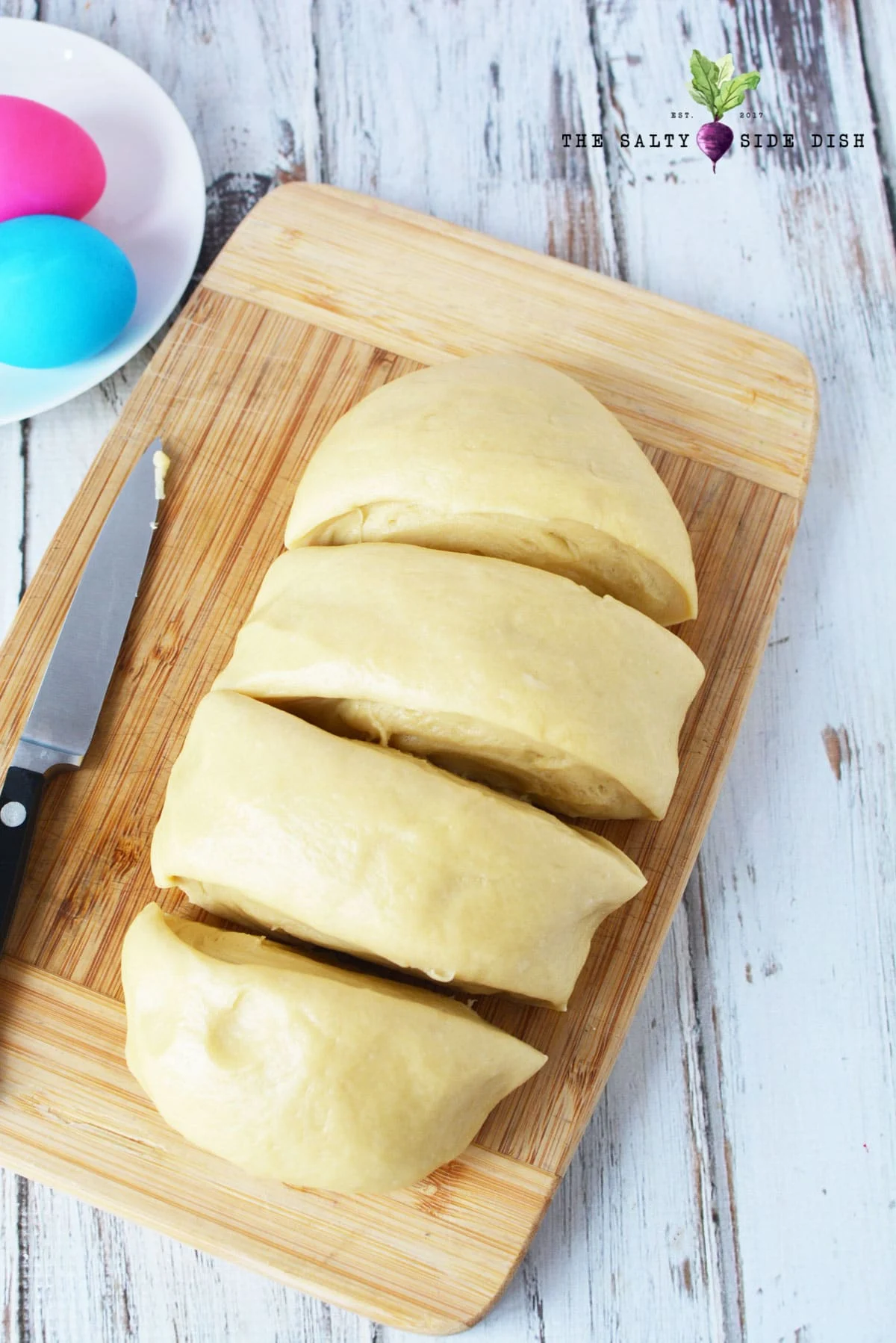 cut puffy dough into four pieces