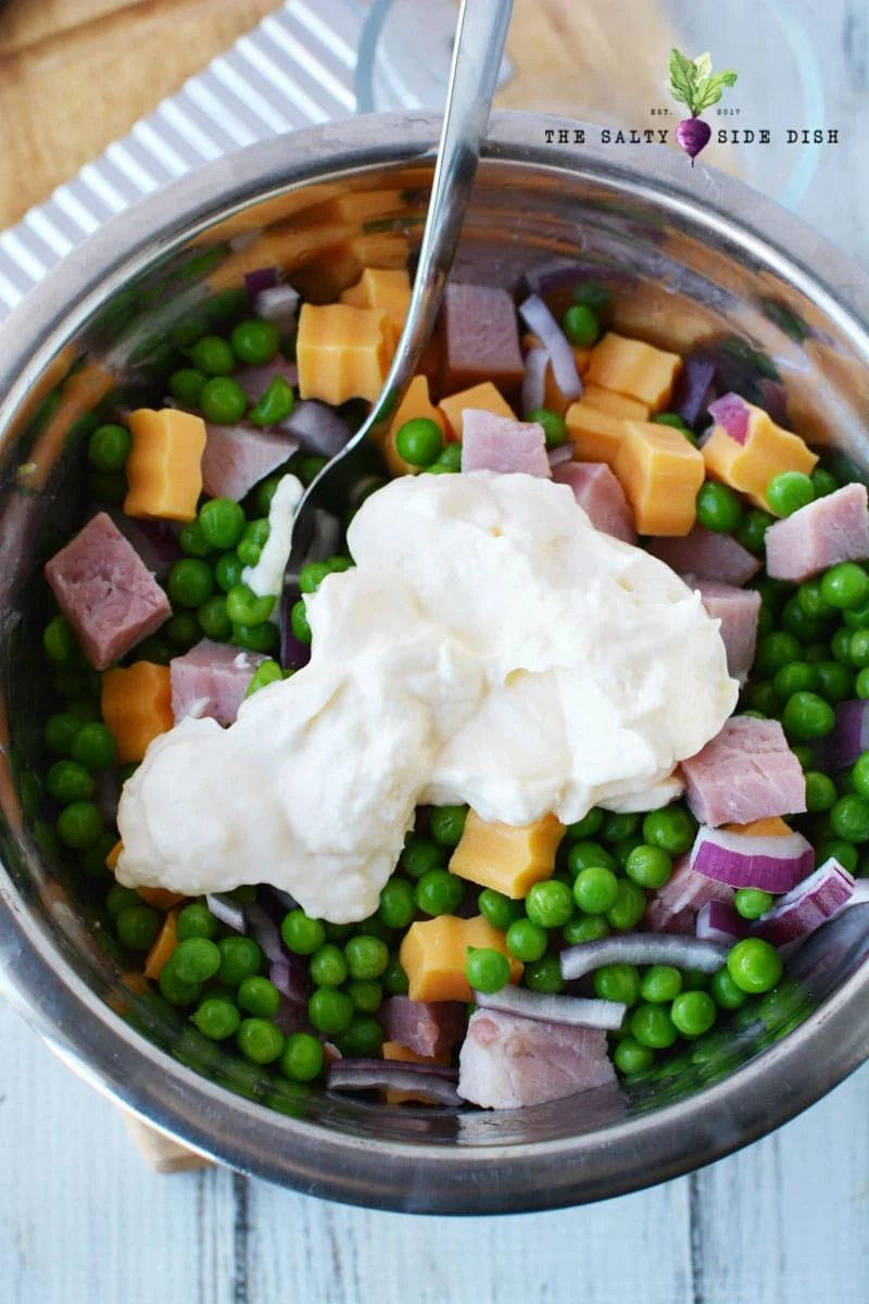 mix all your cheese and pea salad up into a bowl and top with hellmanns mayo