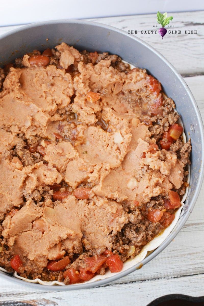 refried beans in your taco pie layers, use a spatula to make the pie