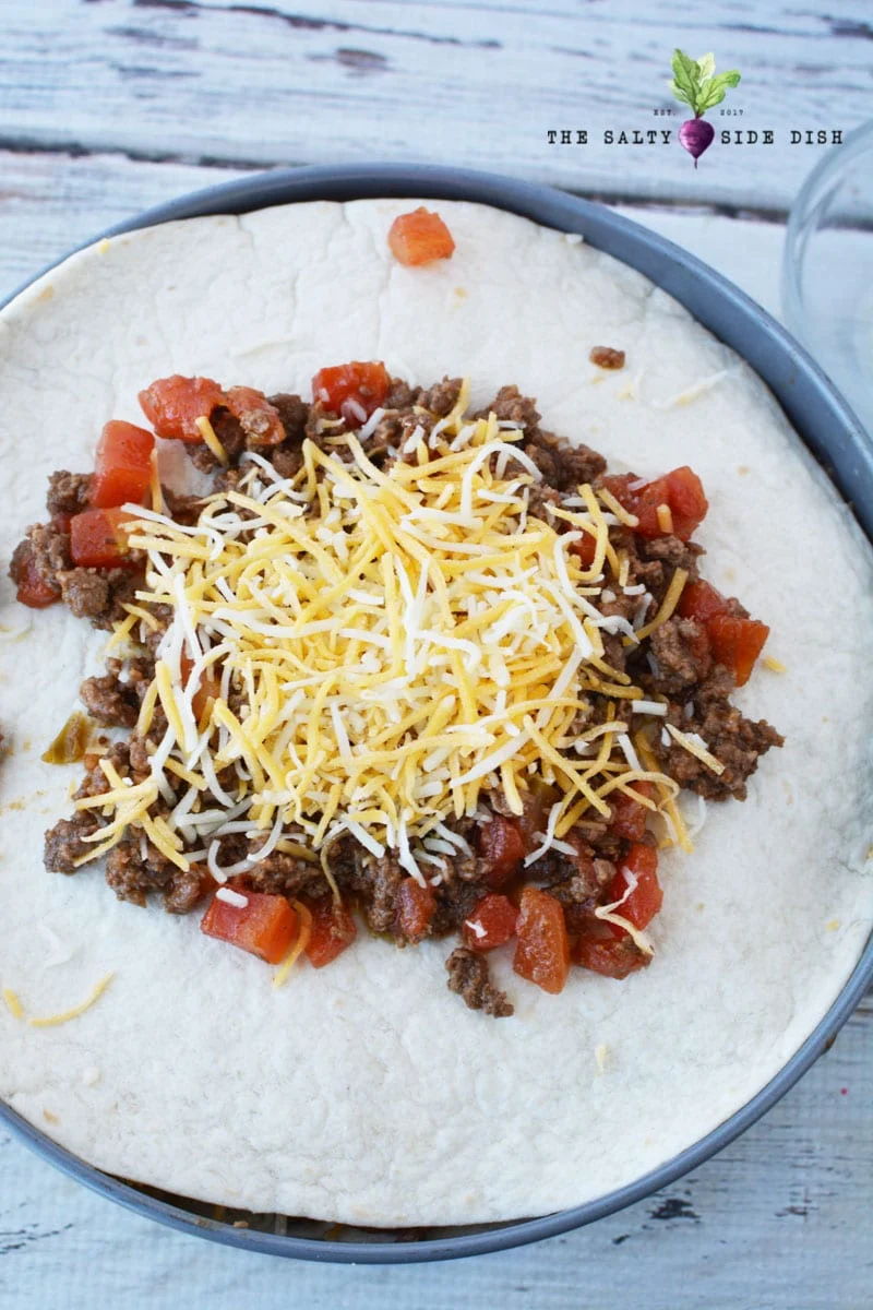 stack up beef, tomatoes, cheese and beans with your flour tortillas