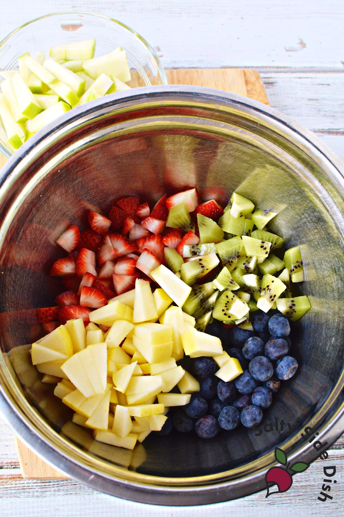 cutting up fruits for salsa.