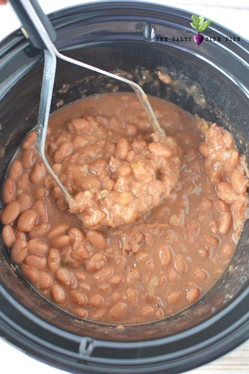 mash refriend beans in crock pot
