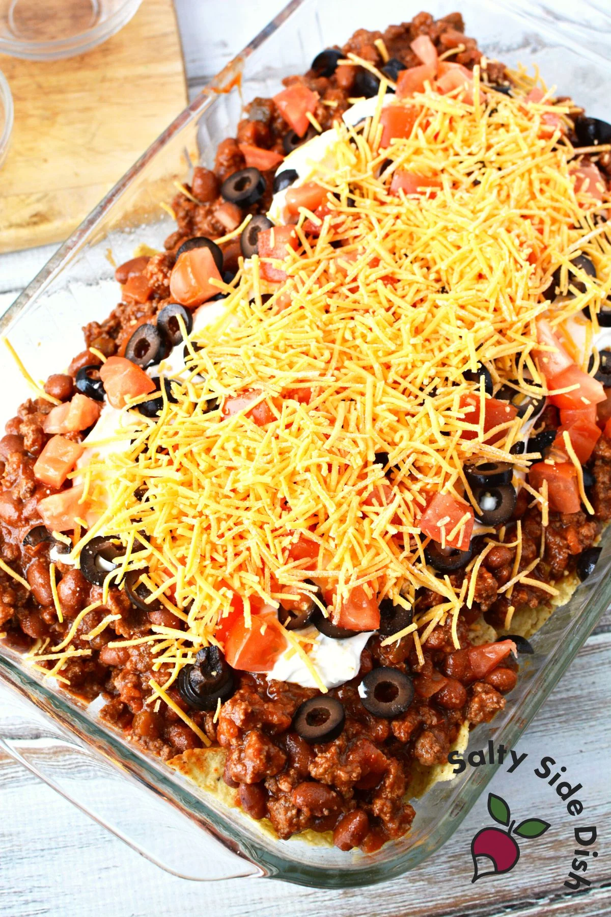 pile toppings high on mexican nacho casserole.