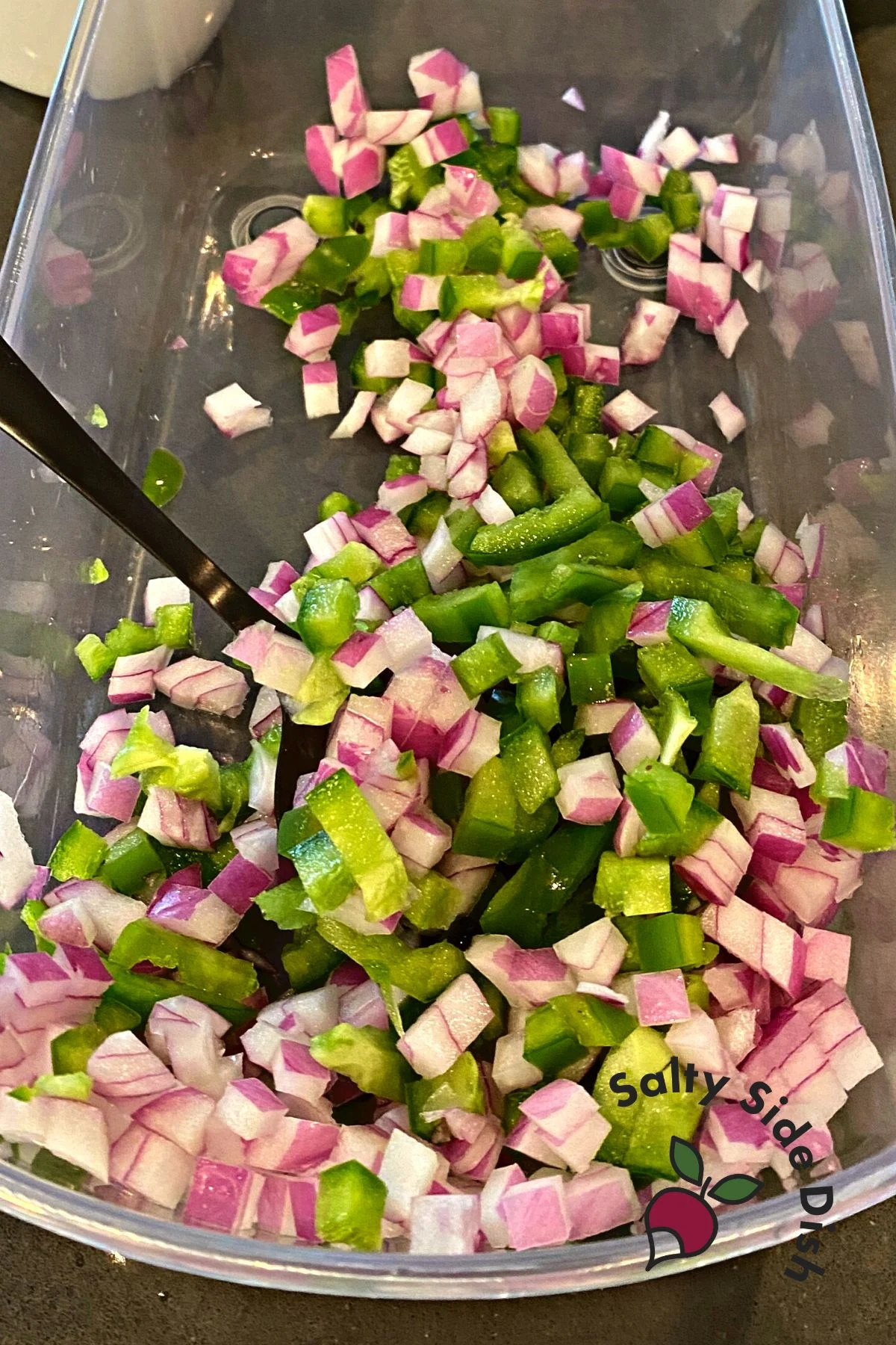 diced onions and green peppers in a chopper