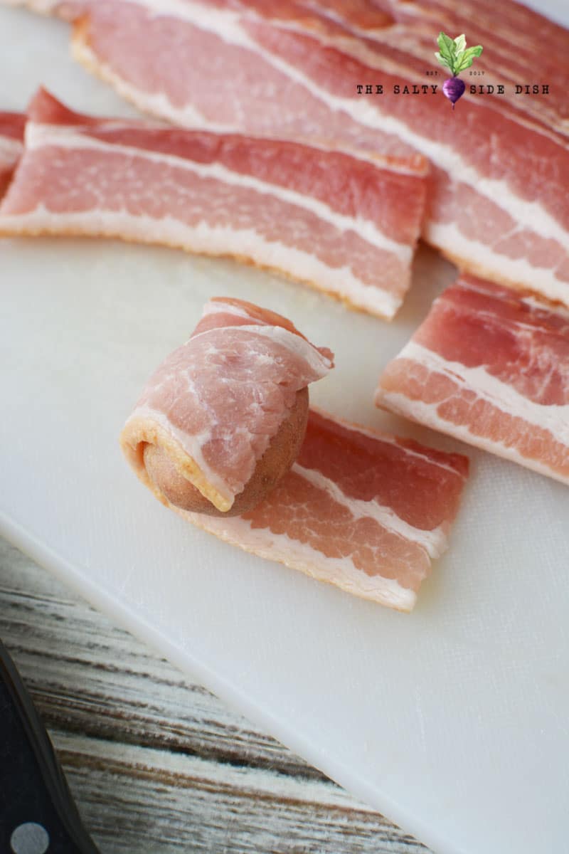 wrap red potato in bacon and place seam down