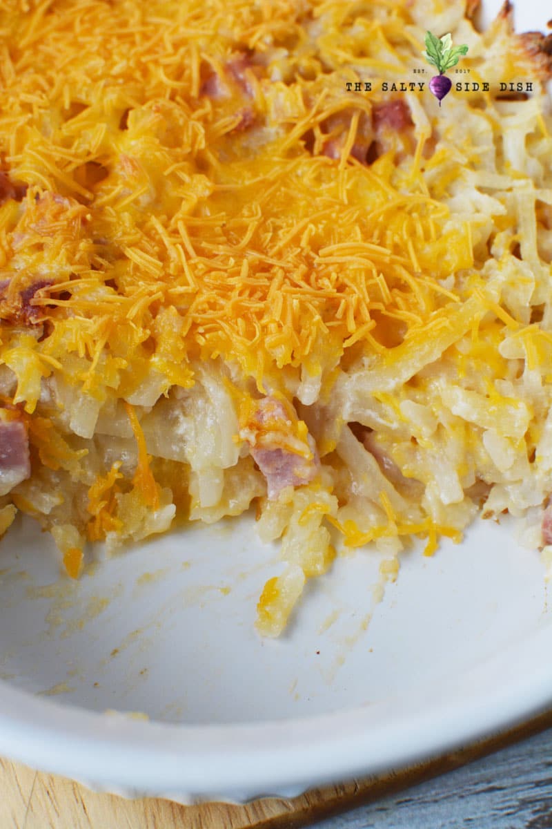 ham and hash brown casserole with tons of melty cheese as a topper is a great breakfast casserole recipe, already a scoop gone